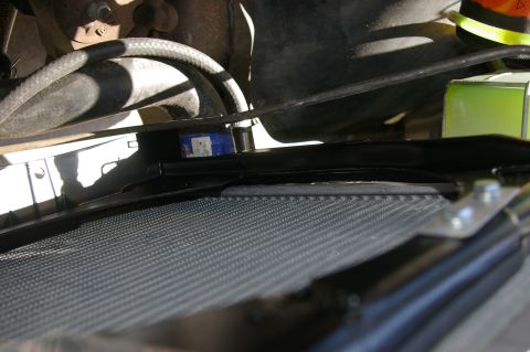 1986 Ford Bronco - Close-up view of the radiator and fan shroud within the engine bay.