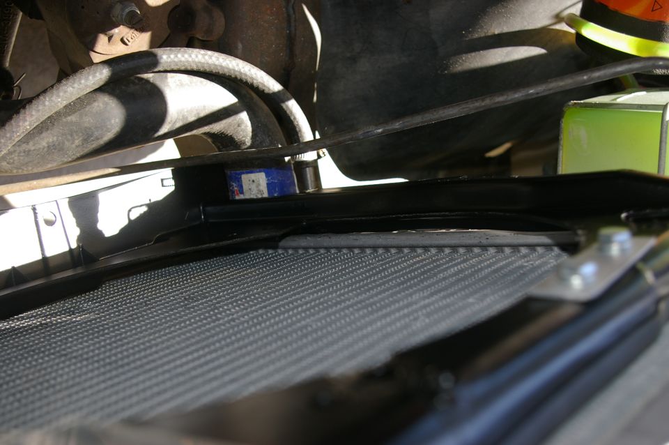 Radiator and fan shroud in engine bay, close-up