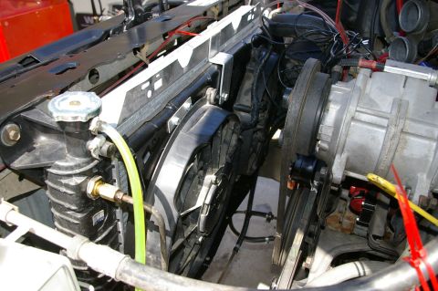 1986 Ford Bronco - Close-up view of an engine's electric fan and radiator, showing hoses and wiring details.