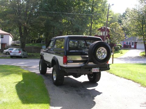 1994 Ford Bronco - This 1994 Ford Bronco is shown from the rear, a spare tire mounted on the custom rear bumper.