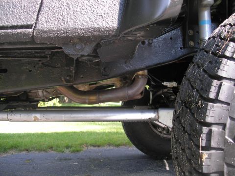 1994 Ford Bronco - Close-up view of the undercarriage and exhaust system of a vehicle.