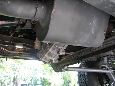 1994 Ford Bronco - Close-up view of the undercarriage, showing the exhaust system and drivetrain components.
