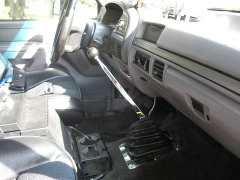 1994 Ford Bronco - Interior view of a 1994 Ford Bronco, highlighting the manual transmission shifter.