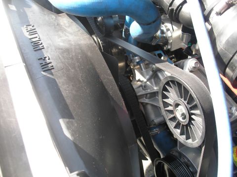 1994 Ford Bronco - Close-up of engine components including fan shroud, belts, and pulleys.