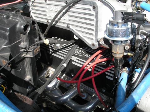 1994 Ford Bronco - Close-up of a Ford engine, showing the valve covers and exhaust manifolds.