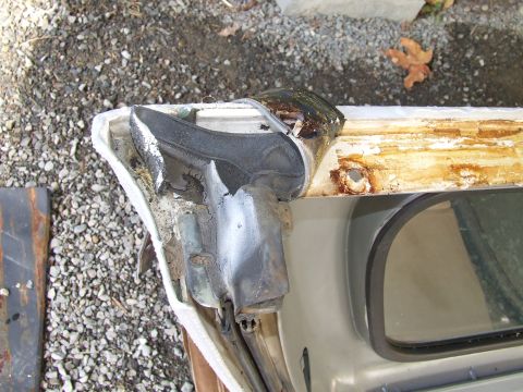 1979 Ford Bronco - Detail of a worn door seal and frame, showing rust and damage. Supermotors.net logo is present.