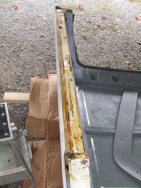 1979 Ford Bronco - The interior of a vehicle shows a heavily rusted door frame, indicating a need for repair.