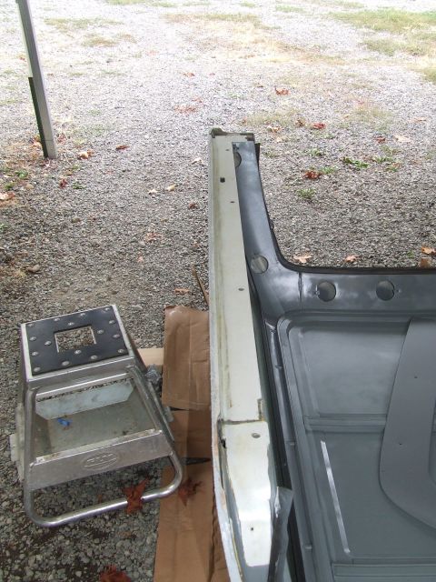 1979 Ford Bronco - Close-up of a vehicle's interior, showing repair work on the body and floor panels.