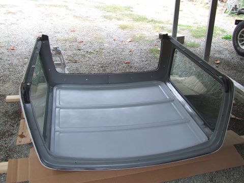 1979 Ford Bronco - This is a removable hardtop, likely for a convertible or SUV, resting on wooden blocks and cardboard.