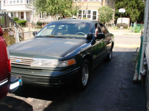 1997 Ford Crown Victoria - This 1997 Ford Crown Victoria is seen from a 3/4 front angle in a driveway.