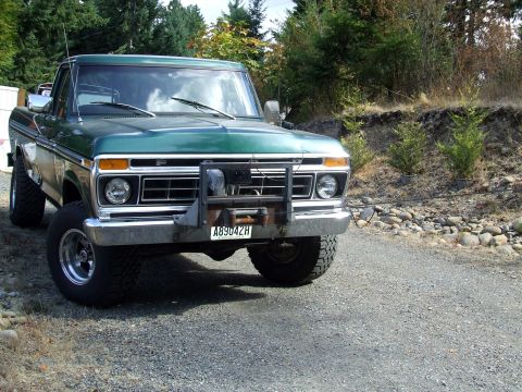 1977 Ford F-150 - 1977 Ford F-150 pickup truck equipped with a front winch, parked outdoors on a gravel road.