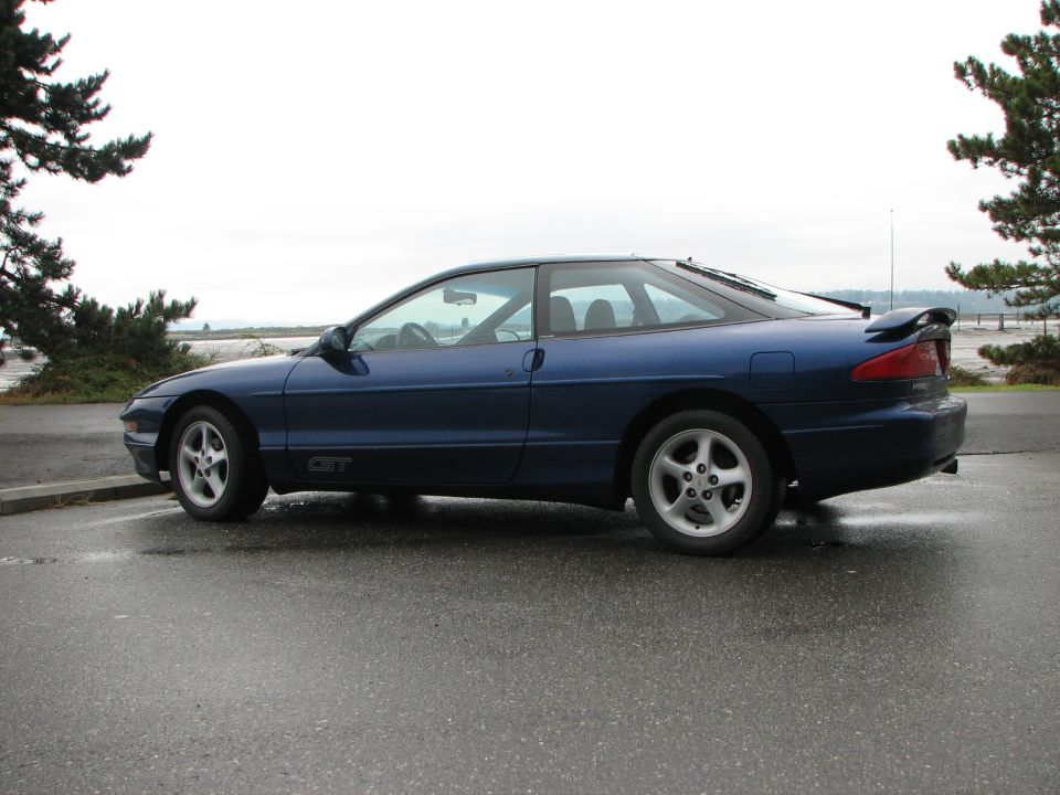 Blue 1994 Ford Probe GT coupe, side view