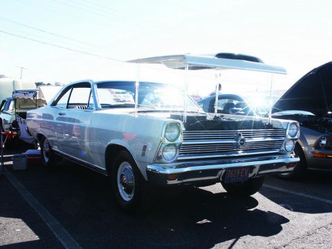 2001 Mercury Grand Marquis - Front view of a 1966 Ford Fairlane 500 at a car show, with a custom canopy overhead.