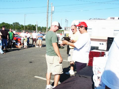 2001 Mercury Grand Marquis - Outdoor car show event with attendees and an awards presentation.