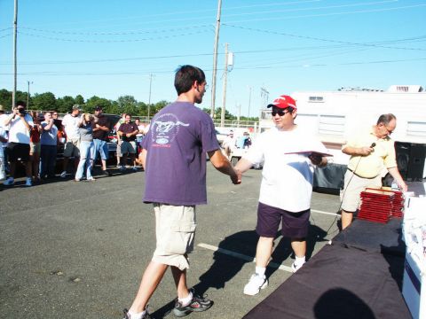 2001 Mercury Grand Marquis - Attendees gather for an award ceremony at an outdoor car show event.