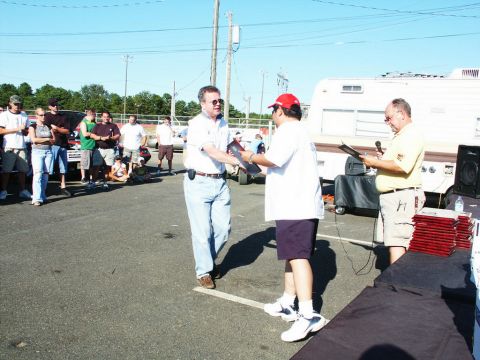 2001 Mercury Grand Marquis - Awards are being presented at an outdoor car show event.