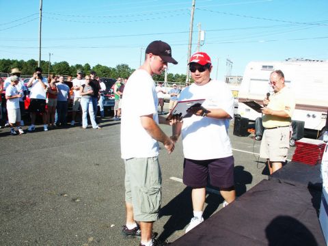 2001 Mercury Grand Marquis - An outdoor event with people gathered, suggesting a car show with awards being presented.