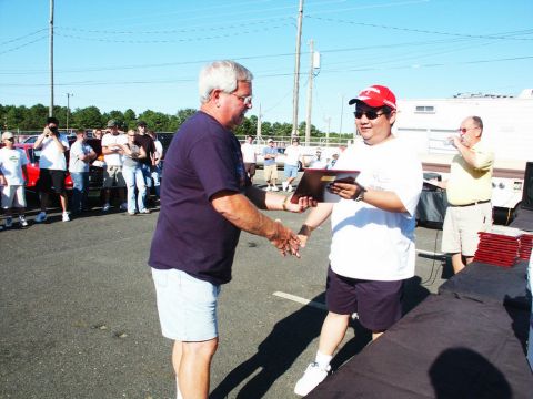 2001 Mercury Grand Marquis - Award presentation at a car show with spectators and vehicles visible.