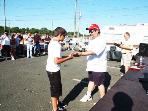 2001 Mercury Grand Marquis - Attendees gather at a car show event, with awards being presented to participants.