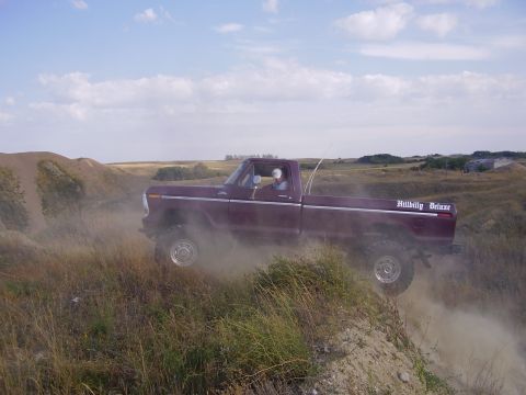 1979 Ford F-250 - This 1979 Ford F-250 is shown off-roading on a dusty hill.