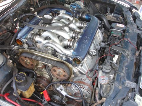 1992 Ford Taurus - Close-up view of a V6 engine, identified by SHO badging on the intake manifold.