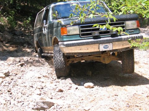 1990 Ford Bronco - This 1990 Ford Bronco navigates a challenging, rocky trail with its front end angled towards the viewer.