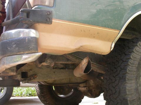 1990 Ford Bronco - The rear section of a lifted Ford Bronco, showing its exhaust and bumper, with a Supermotors.net watermark.