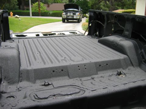 1985 Toyota 4Runner - Truck bed liner application with a second vehicle in the driveway.