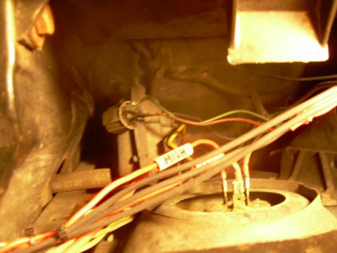 1984 Ford Bronco - Close-up view of a vehicle's interior, showing wiring and tools, possibly during a repair or modification.
