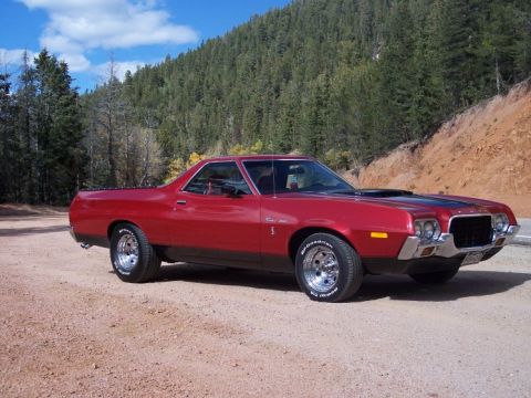 1972 Ford Ranchero - This 1972 Ford Ranchero is parked on a dirt road, with a wooded hillside behind it.