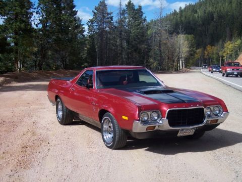 1972 Ford Ranchero - 1972 Ford Ranchero parked on a dirt road with a scenic mountain backdrop.