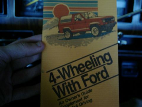 1984 Ford Bronco - Owner's guide supplement for 4x4 driving features a Bronco illustration.