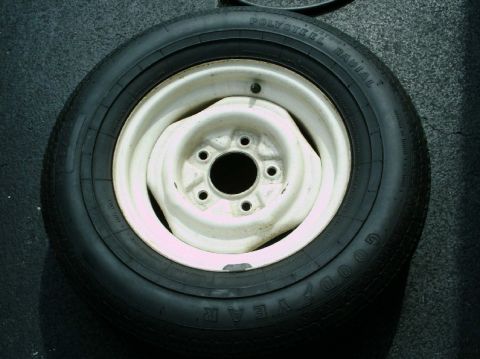 1984 Ford Bronco - Spare tire with Goodyear Polysteel Radial text on a white rim.