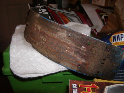 1978 Ford Bronco - A close-up of a corroded metal component with visible blue paint accents.