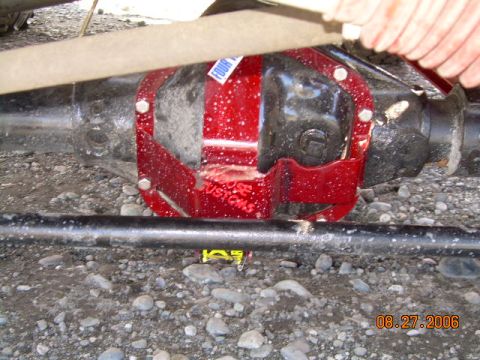 1978 Ford Bronco - Close-up of a vehicle's rear differential with a red custom cover installed.