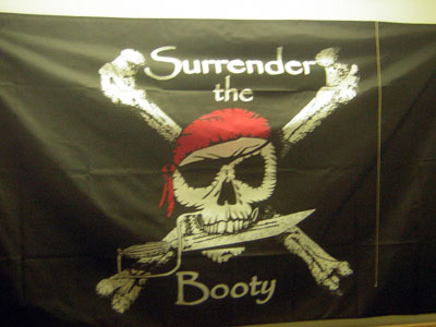 2003 Ford Bronco - Pirate flag with skull and crossbones motif and the phrase 'Surrender the Booty'.