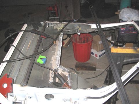 1994 Ford Bronco - Welding a car door frame with a MIG welder and associated tools.