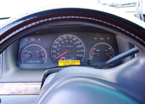 1996 Ford Crown Victoria - Interior view of a 1996 Ford Crown Victoria dashboard, showing gauges and a "Please Check Oil Daily" sticker.