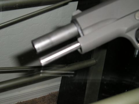 1993 Ford Bronco - Close-up view of a pistol's barrel and slide assembly.