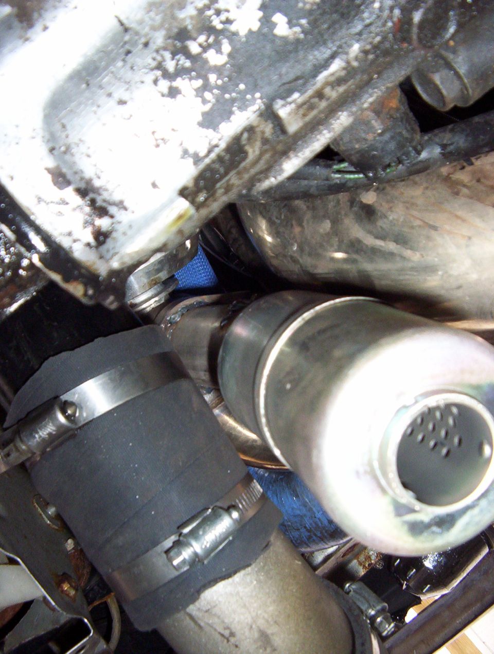 Close-up of undercarriage exhaust and driveline components