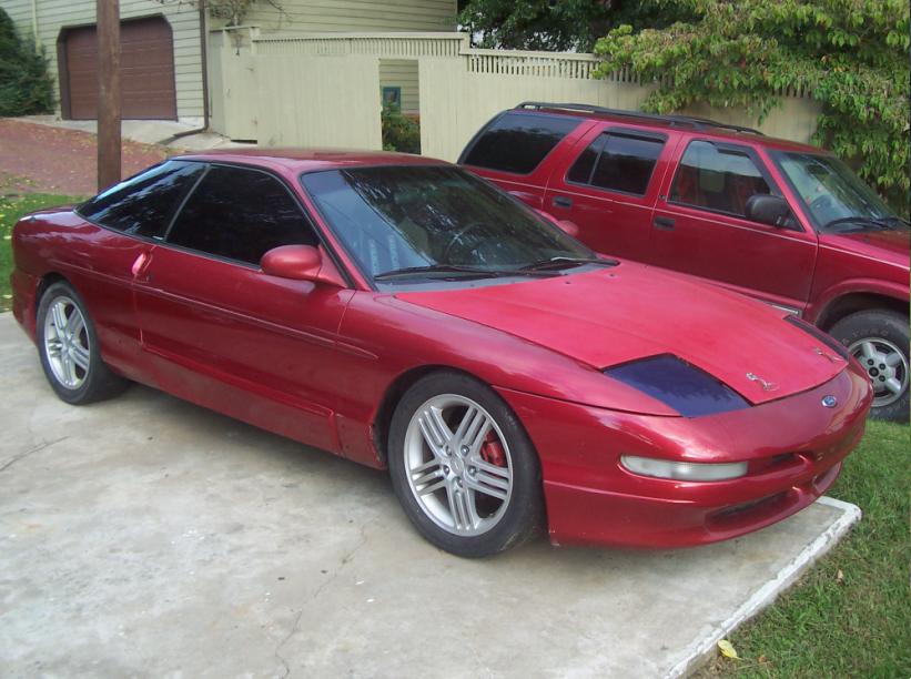 Red 1995 Ford Probe coupe, 3/4 front view