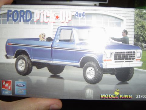 1989 Ford Bronco - Box art for a blue Ford pickup truck model kit, a dog in the bed and a man washing the hood.