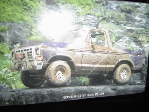 1989 Ford Bronco - Model Bronco built by John Dezan, covered in mud and posed on rocks.