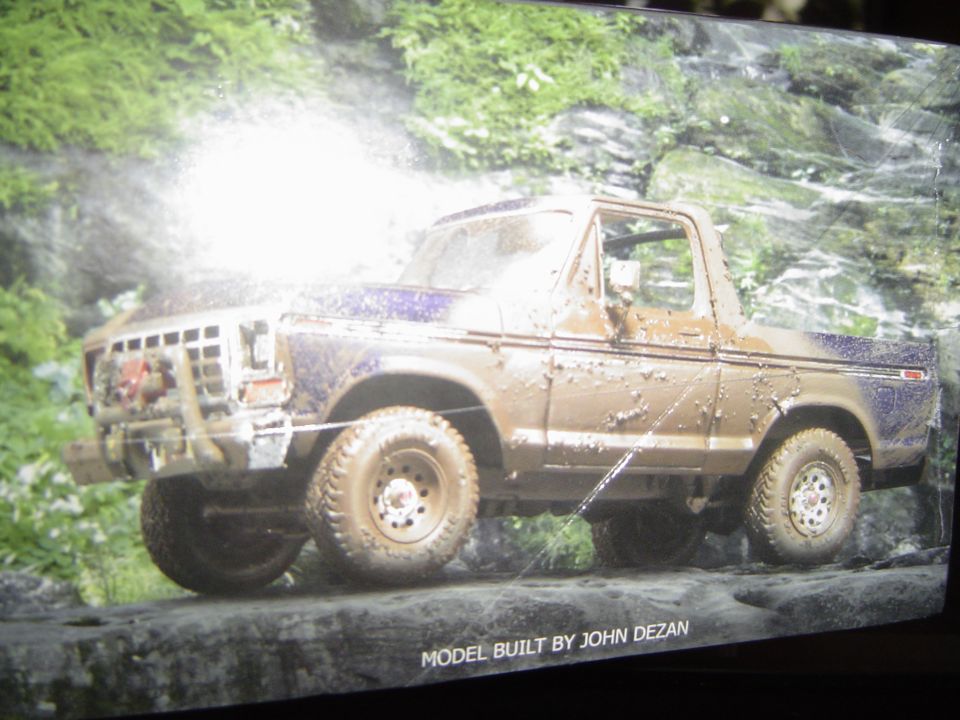 Model kit box art of mud-covered blue open-top Ford Bronco on rocks