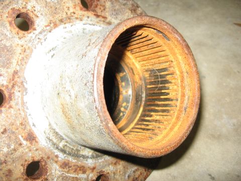 1974 Ford F-100 - Close-up of a corroded vehicle part, likely a wheel hub, showing signs of wear and tear.