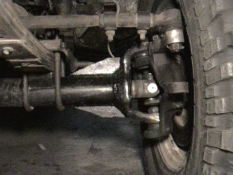 1985 Ford Bronco - After the spring over the steering knuckles pointed down too much. So Bill ground off the welds and spun the knuckles. Beautiful Job Bill!!
