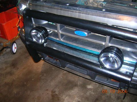 1996 Ford Bronco - Front view of a Ford Bronco grille with off-road lights and a bull bar, dated 09.19.2006.