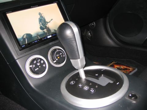 2004 Nissan 350Z - Dvd playing and another shot of DLS Iridium components: tweeter and midrange in stock-looking kick panel. Panel has been custom fiberglass'…