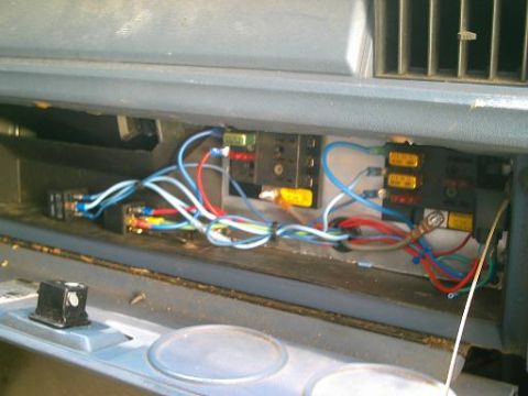 1986 Ford Bronco - Close-up view of a vehicle's wiring harness and electrical components, likely under the dashboard or in the engine bay.