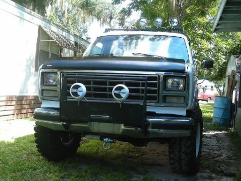 1986 Ford Bronco - Front view of a 1986 Ford Bronco with a bull bar and auxiliary lights mounted.